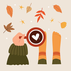 Hand holds fragrant coffee with a heart. Top view. Autumn leaves fall. Festive mood. 
