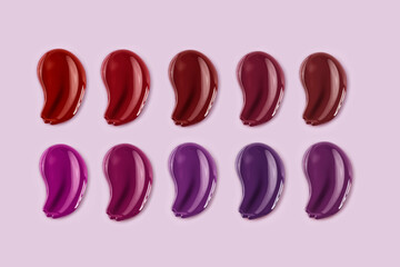 Different lip glosses texture isolated on a pink background.