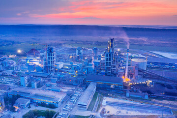 Industrial plant at sunrise in the fog