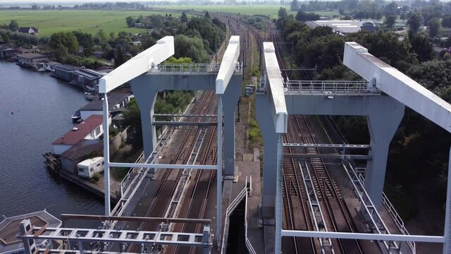 Railway bridge over river Vecht in Holland in the city of Weesp, aerial