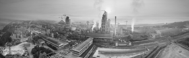 Industrial plant at sunrise in the fog