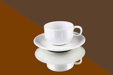 White coffee cup reflection with a saucer on brown and orange  background with clipping path, ready to cut out, copy space for graphic design.