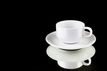 Obraz na płótnie Canvas White coffee cup reflection with a saucer on black background with clipping path, ready to cut out, copy space for graphic design.