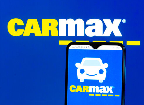 In this photo illustration CarMax, Inc. logo seen displayed on a smartphone