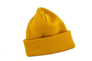 Yellow - Mustard color mercerized knit beret isolated on white background. Winter sports clothes. - obrazy, fototapety, plakaty