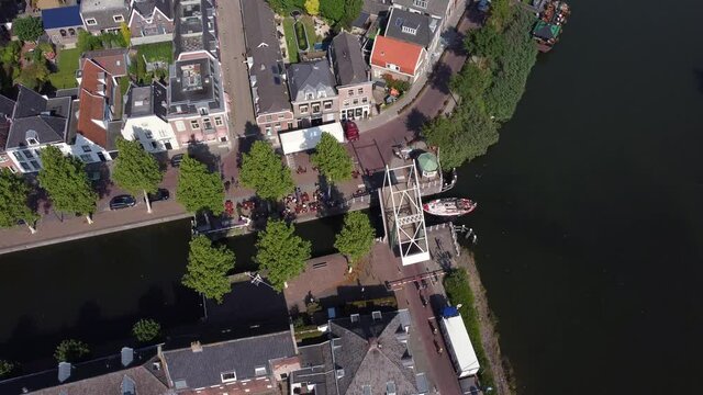 City Weesp in Holland topdown view at boat sailing trough city under opened bridge