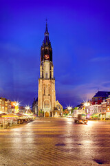 Fototapeta premium Dutch Travel Concepts. Protestant New Gothic Church (Nieuwe Kirche) on Markt Square in Dutch Old City Delft during Blue Hour, in Holland, the Netherlands.