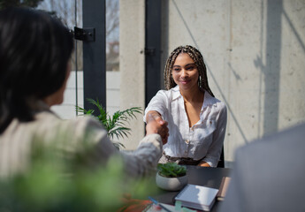 Happy young woman having job interview in office, business and career concept.