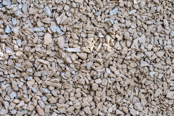 The texture of dirty rubble. Background of small stone covered with mud