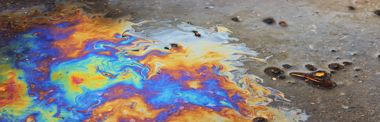 spilled gasoline rainbow background, industrial hazard spill pollution, abstract texture multicolored