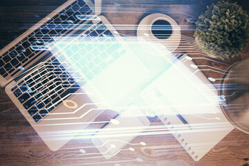 Multi exposure of data theme drawing hologram over topview work desk background with computer. Concept of technology.