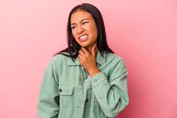 Young latin woman isolated on pink background  touching back of head, thinking and making a choice.