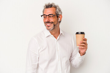 Middle age business man holding a take away coffee isolated on white background  looks aside smiling, cheerful and pleasant.