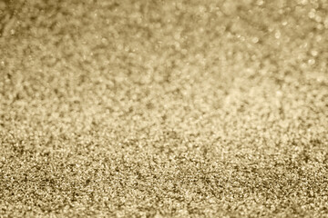 Abstract gold glitter sparkle blurred with bokeh background