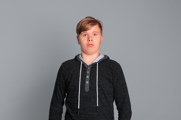 Portrait of funny astonished, shocked boy. Teen boy opening his mouth widely, shocked with...