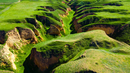 Canyon cliffs mountains green grass top view