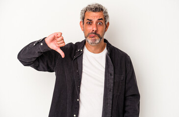 Middle age caucasian man isolated on white background  showing a dislike gesture, thumbs down....
