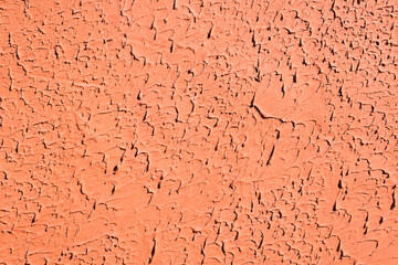Decorative orange putty, plaster with imitation of a brush, drips to the side, textured background of the wall outside