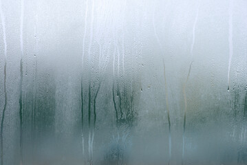 Window with condensate or steam after heavy rain, large texture or background.