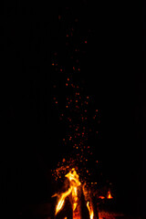 flame of fire with sparks on a black background