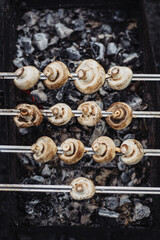 Champignon white mushrooms grilled on grill