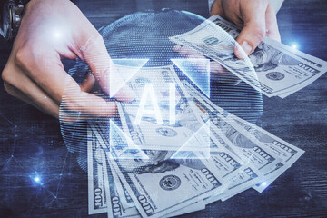 Multi exposure of technology drawing hologram and us dollars bills and man hands. Data concept