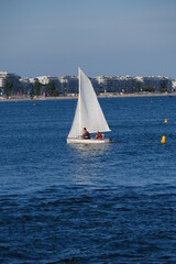 Obraz premium A sailing boat in the bay of la Baule. The 12th august 2021, le Pouliguen, France.