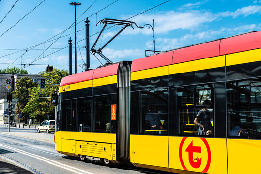 Yellow Tram Circulating In Warsaw, Poland