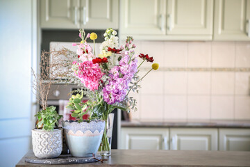 Fototapeta na wymiar Beautiful bunch of cottage flowers on display in country kitchen