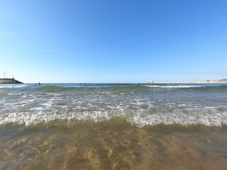 Beach in the morning with waves. Summertime