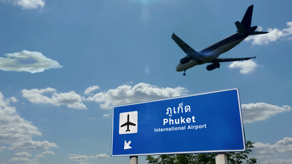 Plane landing in Phuket Thailand airport with signboard