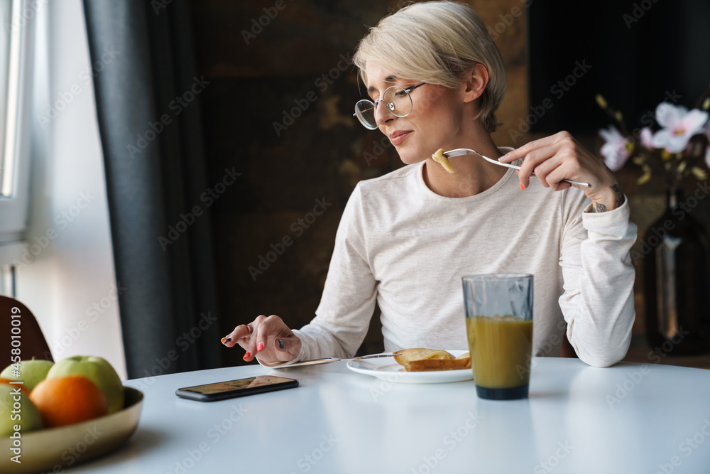 Wall mural Smiling young woman wearing casual clothes