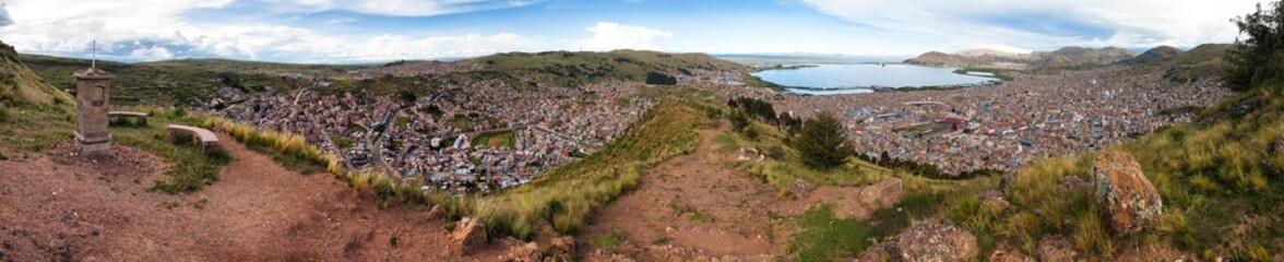 Fototapeta na wymiar Puno city and Titicaca lake panoramic view from Peru