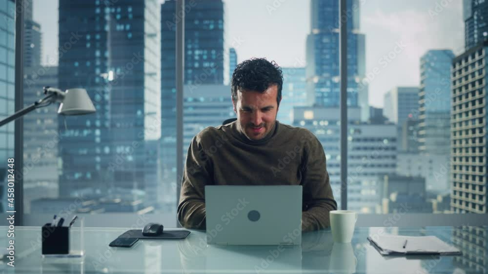 Poster portrait of relaxed brilliant businessman working on laptop computer in his big city office. charism