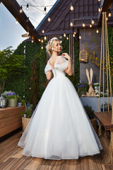 Sexy beautiful blonde woman pretty bride wedding big day marriage ceremony in summer garden wearing long silk and lace white dress bright makeup hairstyle pure love interior.