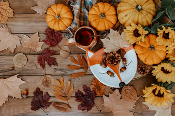 Autumn composition with dried leaves, pumpkins on wooden background. Autumn, fall, halloween, thanksgiving day concept. Flat lay, top view, copy space. Autumn still life