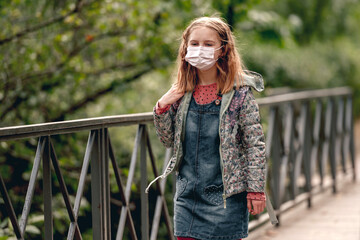 Schoolgirl wearing face mask
