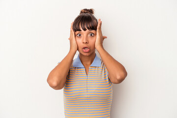 Young mixed race woman isolated on white background  being shocked, she has remembered important meeting.