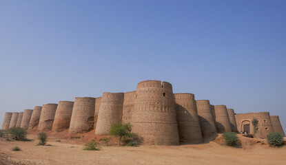 Landscape panorama view of landmark ancient Derawar fort with its forty brick bastions in the Cholistan desert, Bahawalpur, Punjab, Pakistan - obrazy, fototapety, plakaty