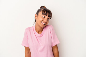 Young mixed race woman isolated on white background  laughs and closes eyes, feels relaxed and happy.