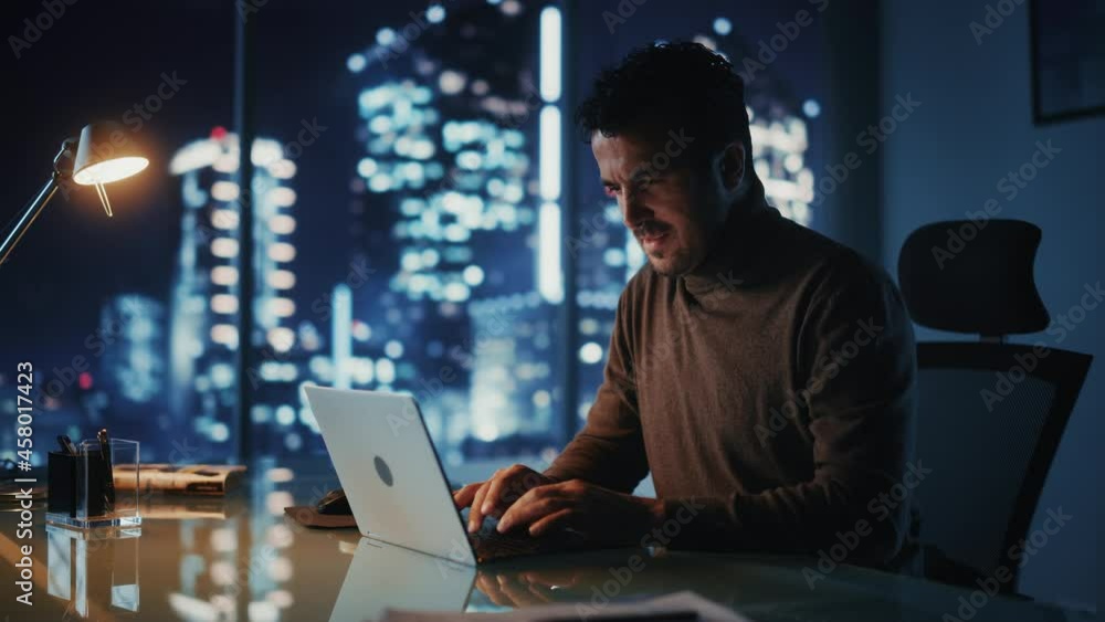 Aufkleber portrait of thoughtful successful businessman working on laptop computer in his big city office at n
