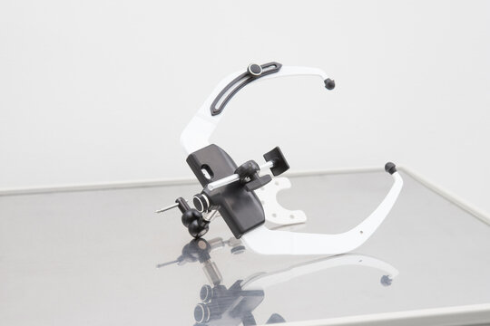 The face bow used in dentistry lies on the table. Orthopedic instrument. Modern technologies