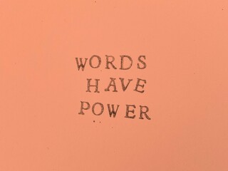 Photograph of letters stamped in black ink, rustic image, colors background, traditional typewriter typography. Ideal for creating posts for your social networks and blog.