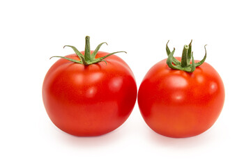 Two ripe red tomatoes on a white background