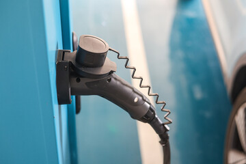 Power supply connect to electric vehicle for charge to the battery. Charging technology industry...