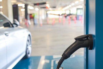 Power supply connect to electric vehicle for charge to the battery. Charging technology industry...