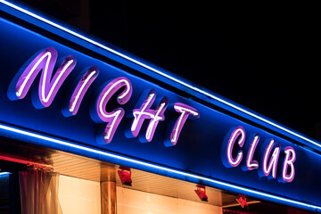 Neon glowing signboard of night club