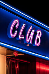 Neon glowing signboard of club