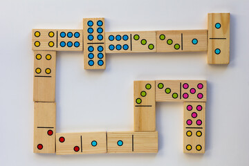 Top view of wooden dominoes gaming pieces on the white background