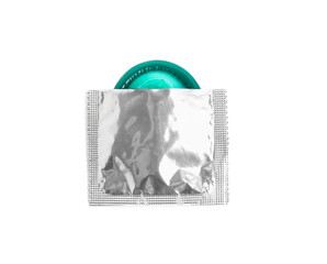 Torn condom package isolated on white, top view. Safe sex